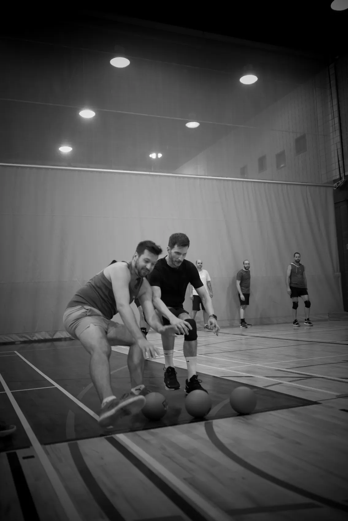 Players reaching for dodgeballs at the opening rush