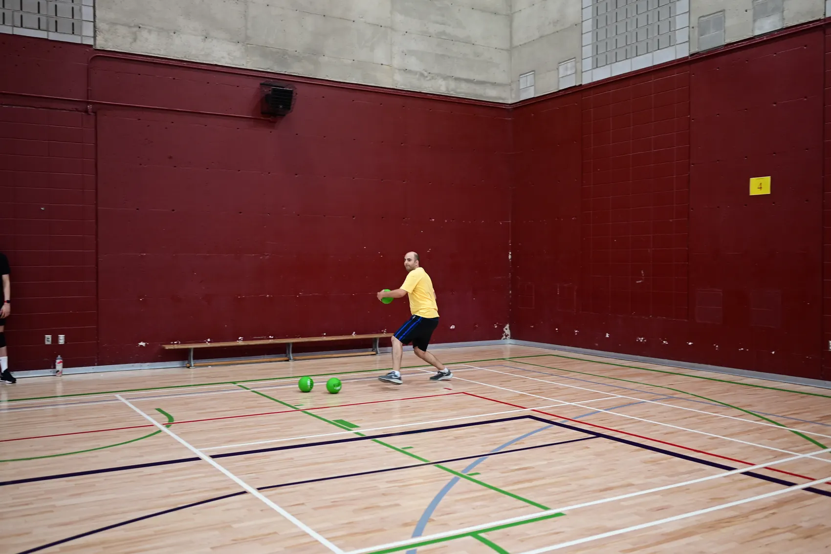 Player throwing across the court