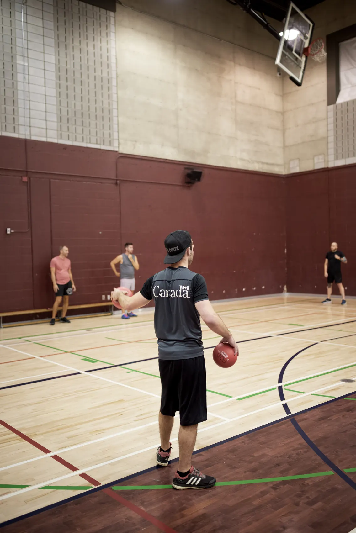 Player waiting with a dodgeball on court
